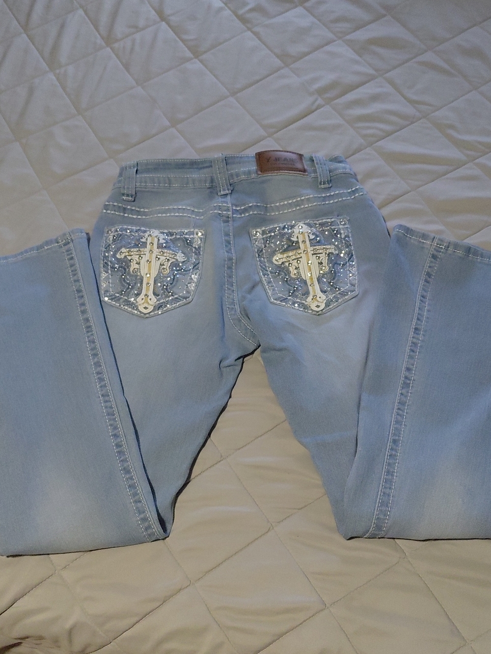 Light Blue Boot Cut Jeans with Embellished Cross Back Pockets